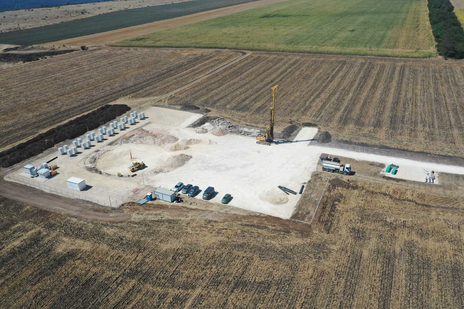 Drone view of the Balchik Wind IV crane pad and battery storage area in the farmland near Balchik