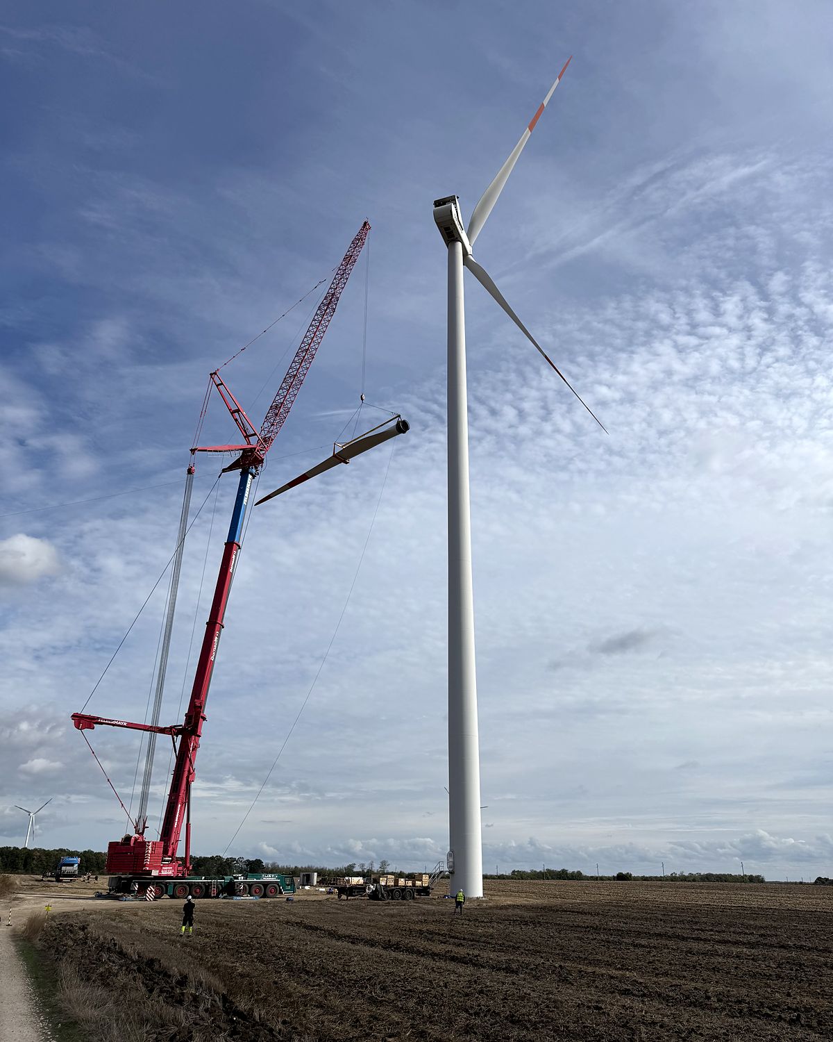 Large crawler crane beside a Balchik Wind II turbine during a major component exchange