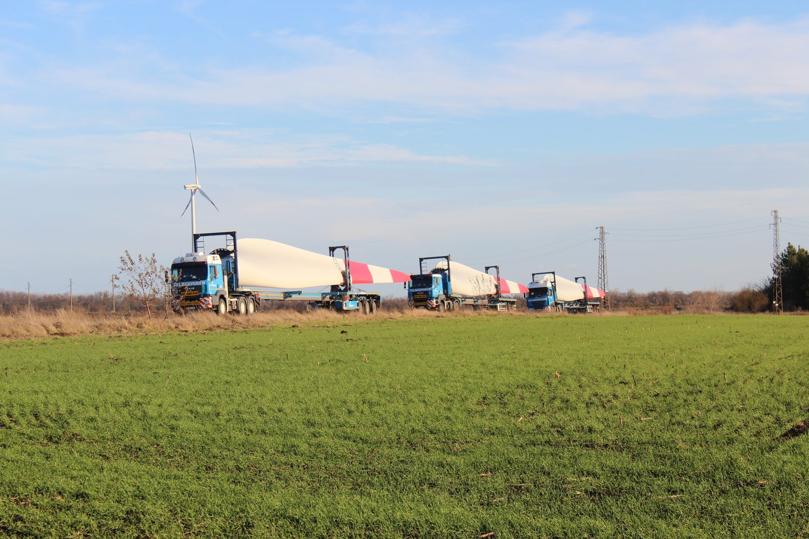 Rotor blades for Balchik Wind II arriving on special transport trucks across the fields