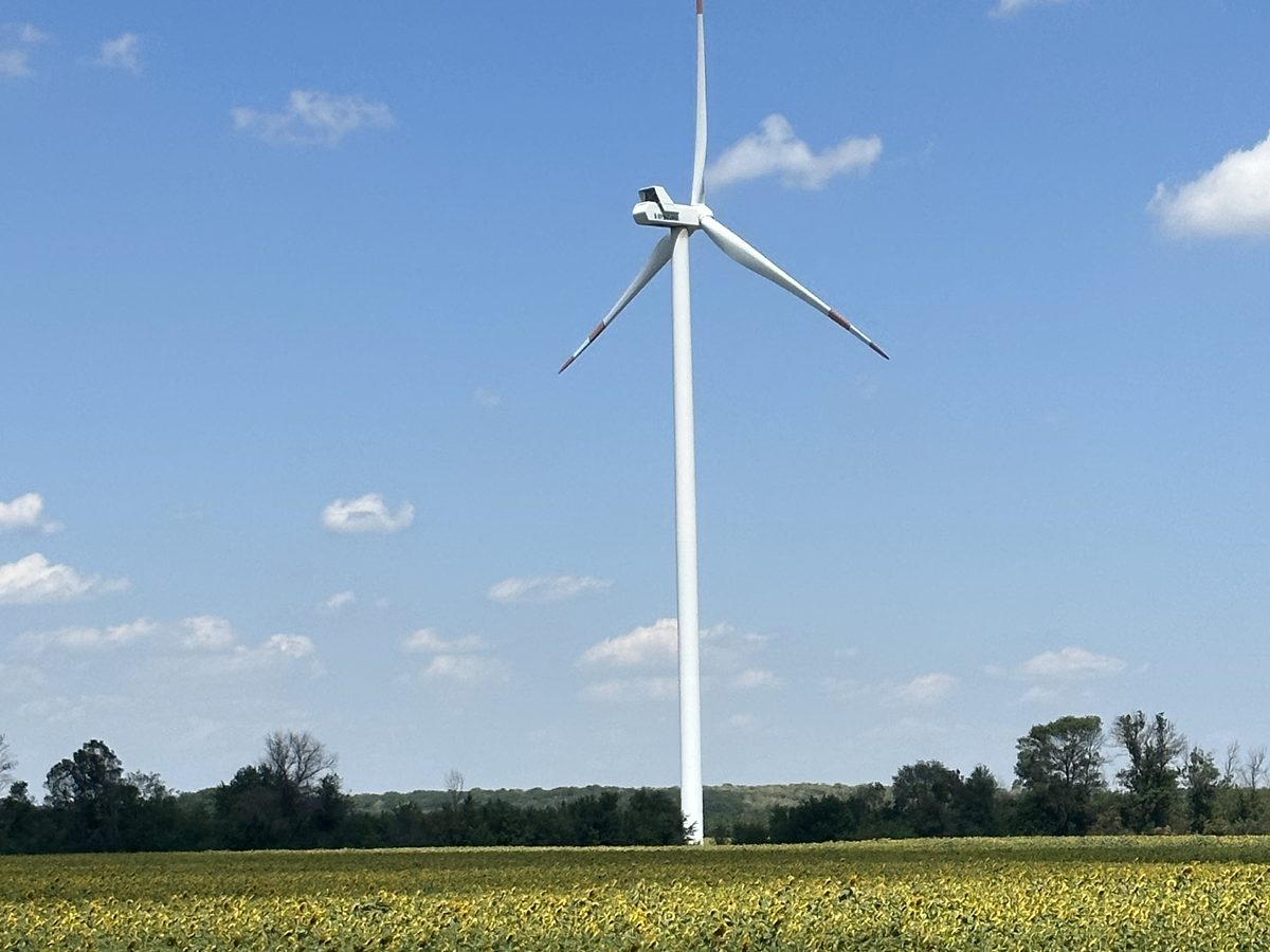 The finished Balchik Wind II turbine above green fields on a clear day
