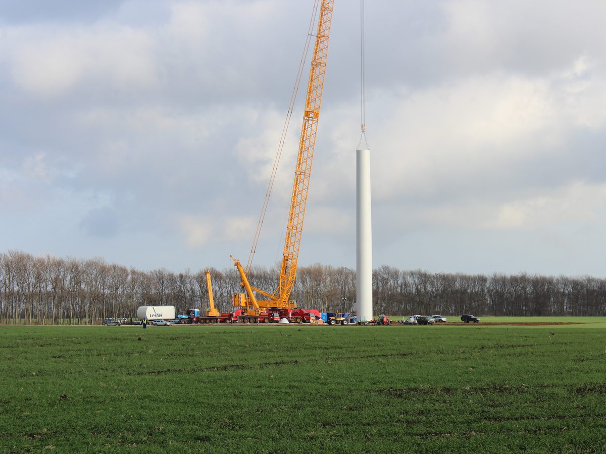 Crawler crane beside a newly erected tower section at Balchik Wind II